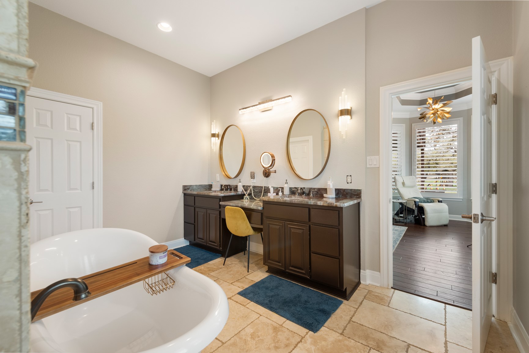 664 Ranchers Club Lane Driftwood, TX 78619 - Photo 9 of 40 a living room with furniture a mirror a clock and a windows