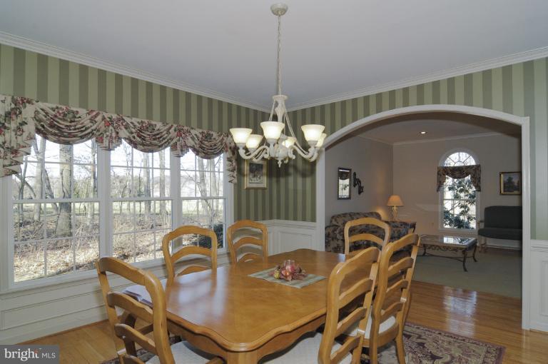 2135 Misty Meadow Road Finksburg, MD 21048 - Photo 23 of 27 a view of a dining room with furniture window and wooden floor