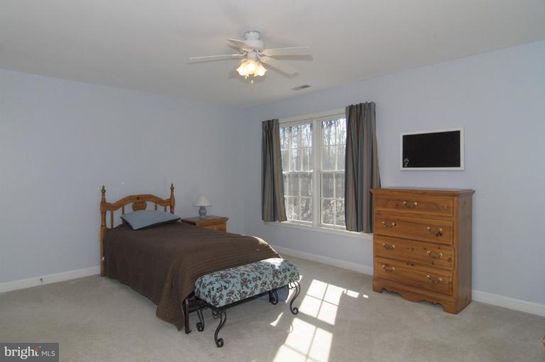 2135 Misty Meadow Road Finksburg, MD 21048 - Photo 9 of 27 a bedroom with a bed and a tv