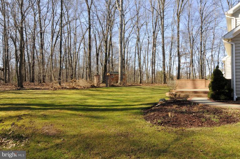 2135 Misty Meadow Road Finksburg, MD 21048 - Photo 10 of 27 a view of swimming pool with large trees and wooden fence