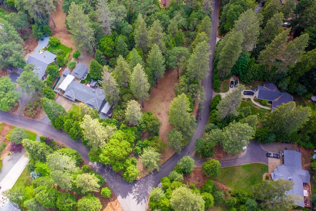 an aerial view of house with yard