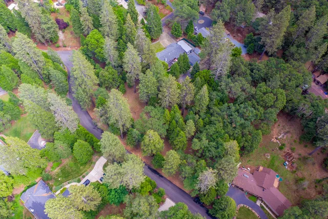 an aerial view of house with yard