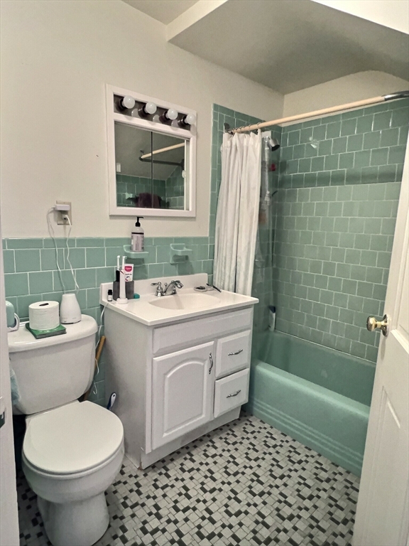 25 Garrison Road, Unit 1R Brookline, MA 02445 - Photo 5 of 5 a bathroom with a sink toilet and shower