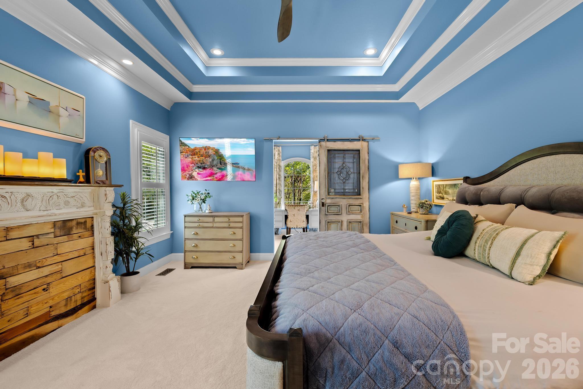 340 Riverwood Road Mooresville, NC 28117 - Photo 11 of 48 a bedroom with a bed and a flat screen tv