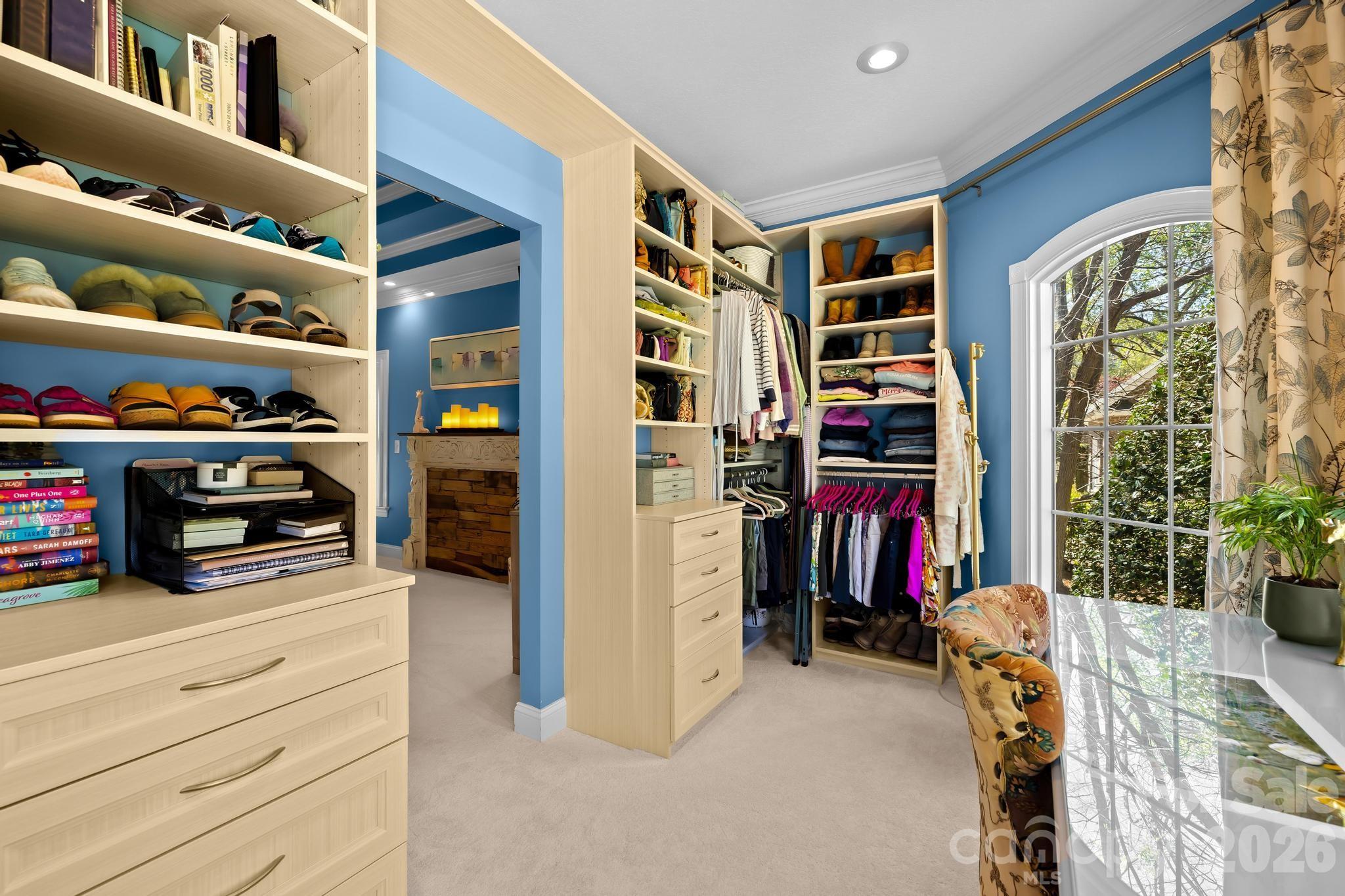 340 Riverwood Road Mooresville, NC 28117 - Photo 13 of 48 a view of walk in closet with clothes and shoes