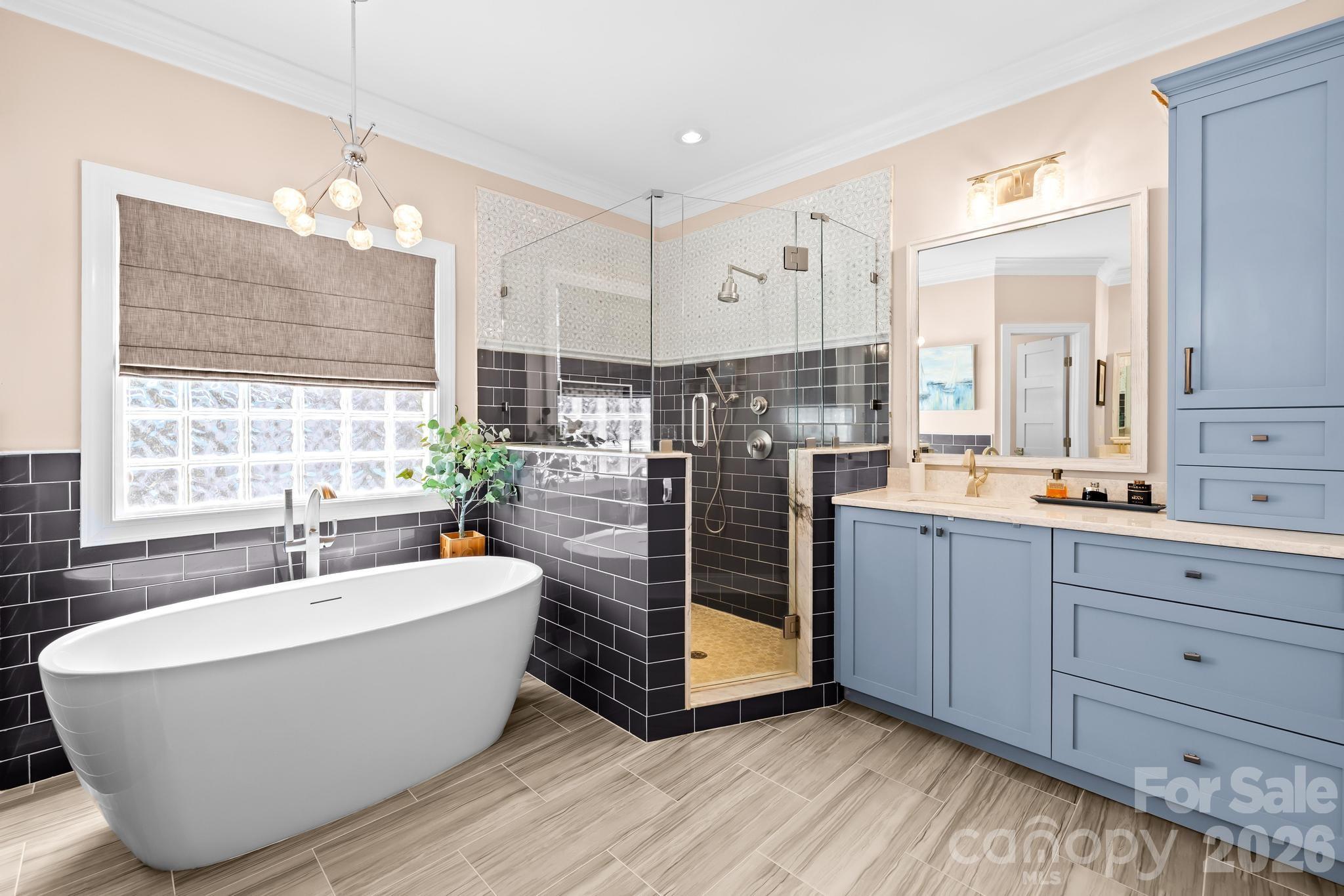 340 Riverwood Road Mooresville, NC 28117 - Photo 14 of 48 a spacious bathroom with double vanity and a bathtub