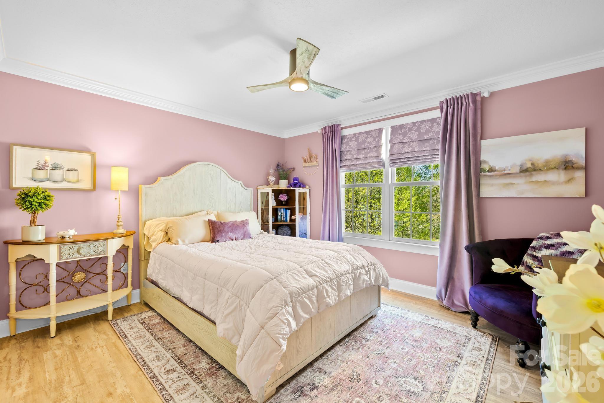 340 Riverwood Road Mooresville, NC 28117 - Photo 25 of 48 a bedroom with a bed and a dresser next to a window
