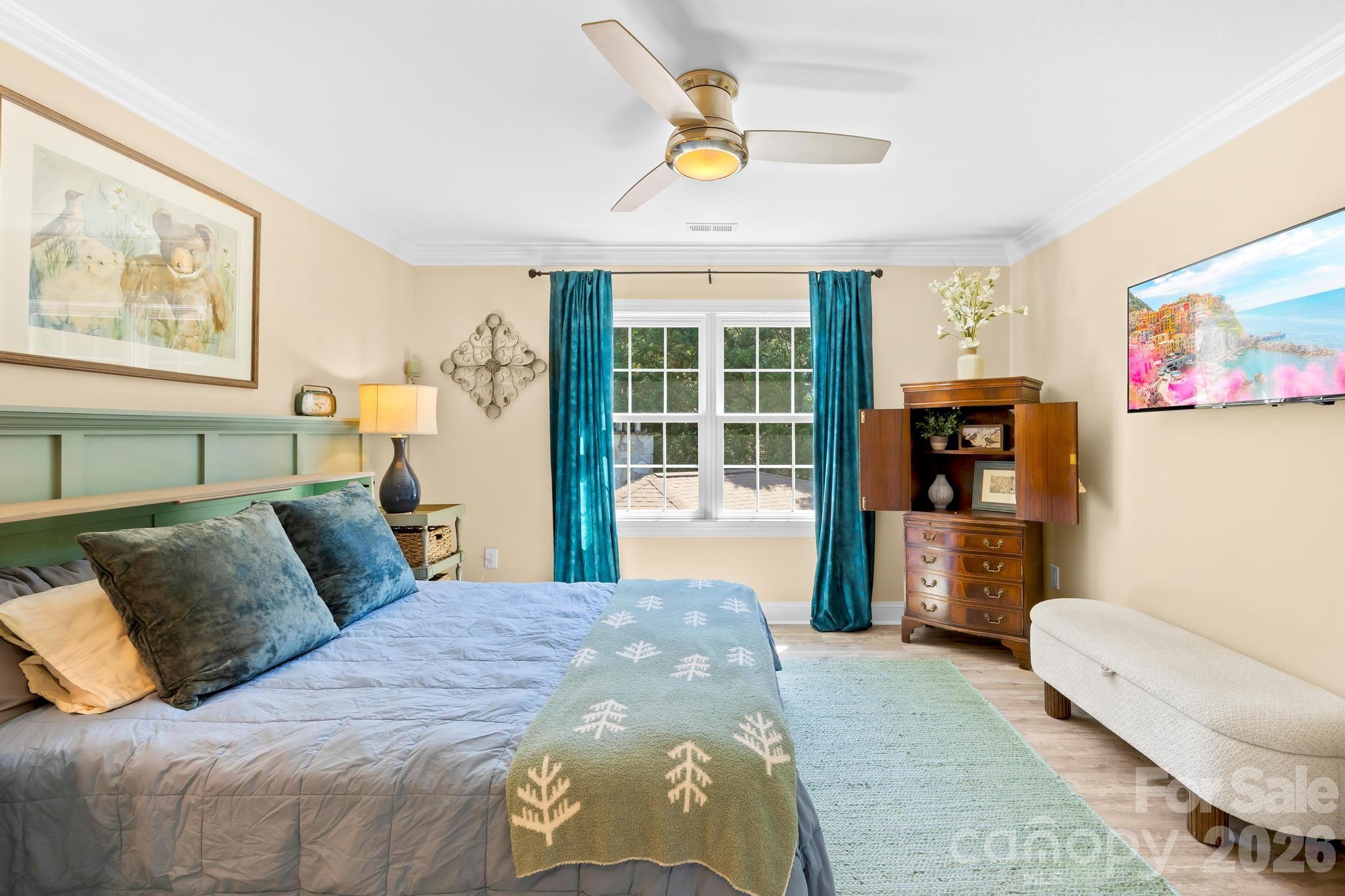 340 Riverwood Road Mooresville, NC 28117 - Photo 28 of 48 a bedroom with a bed and a couch