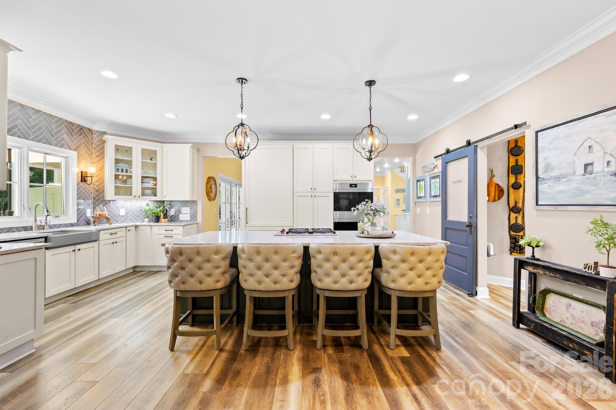 340 Riverwood Road Mooresville, NC 28117 - Photo 5 of 48 a view of a dining room with furniture window and wooden floor