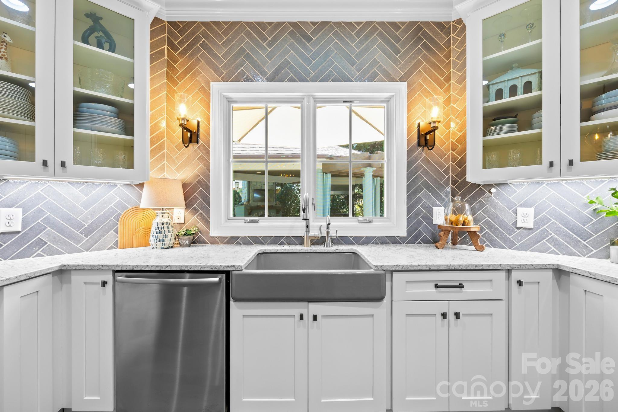 340 Riverwood Road Mooresville, NC 28117 - Photo 8 of 48 a kitchen with granite countertop a sink and white cabinets