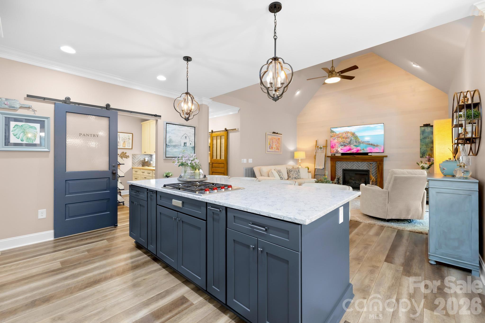 340 Riverwood Road Mooresville, NC 28117 - Photo 9 of 48 a large kitchen with stainless steel appliances a large center island attached withe living room