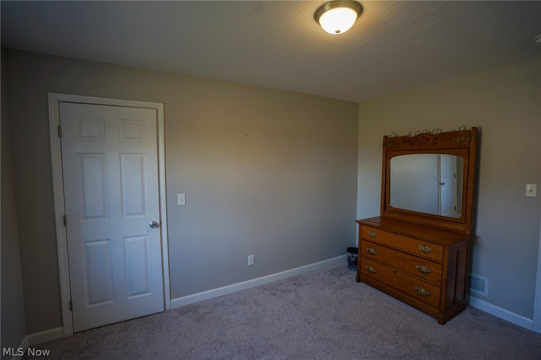 1325 County Line Road Hopewell, OH 43746 - Photo 21 of 45 Unfurnished bedroom with carpet flooring and baseboards