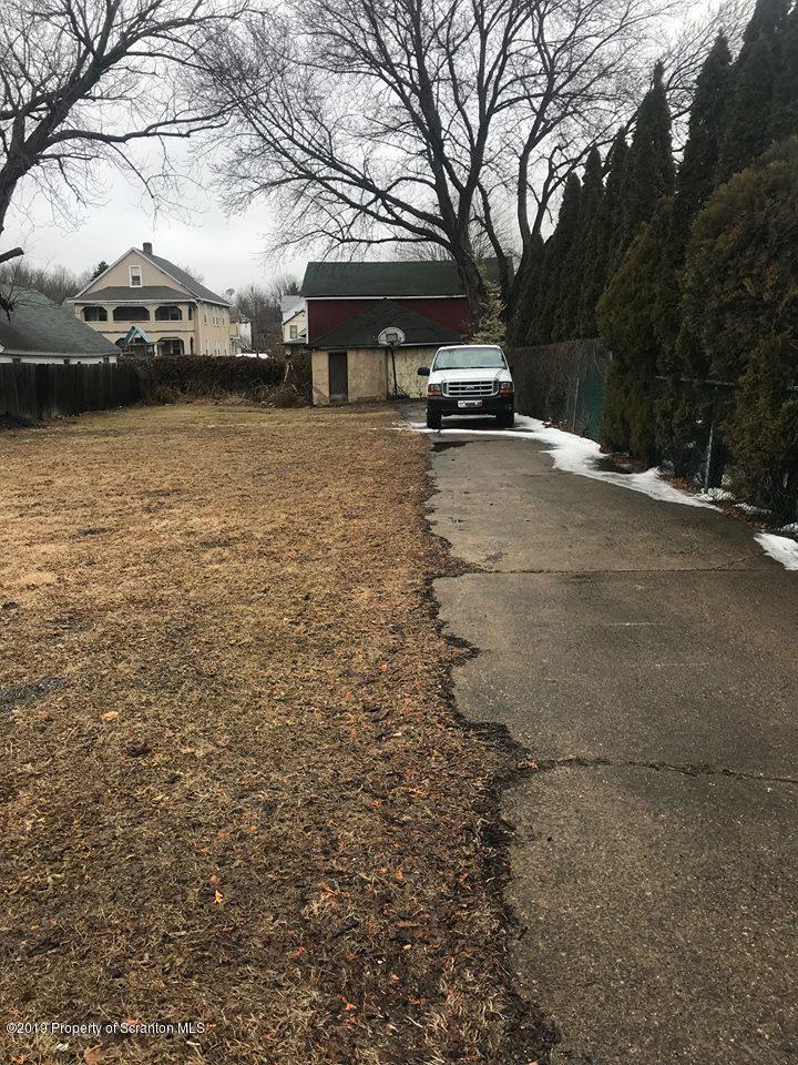 513 Maple Street Old Forge, PA 18518 - Photo 3 of 3 a view of a car parked in front of a house