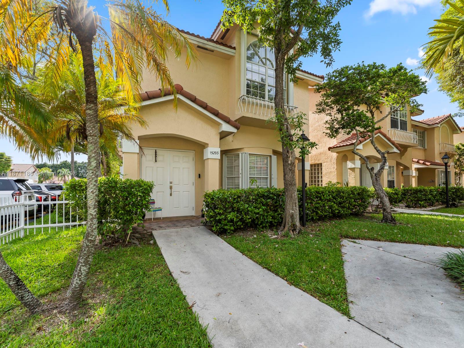 15293 Southwest 111th Street Miami, FL 33196 - Photo 12 of 32 a front view of a house with garden