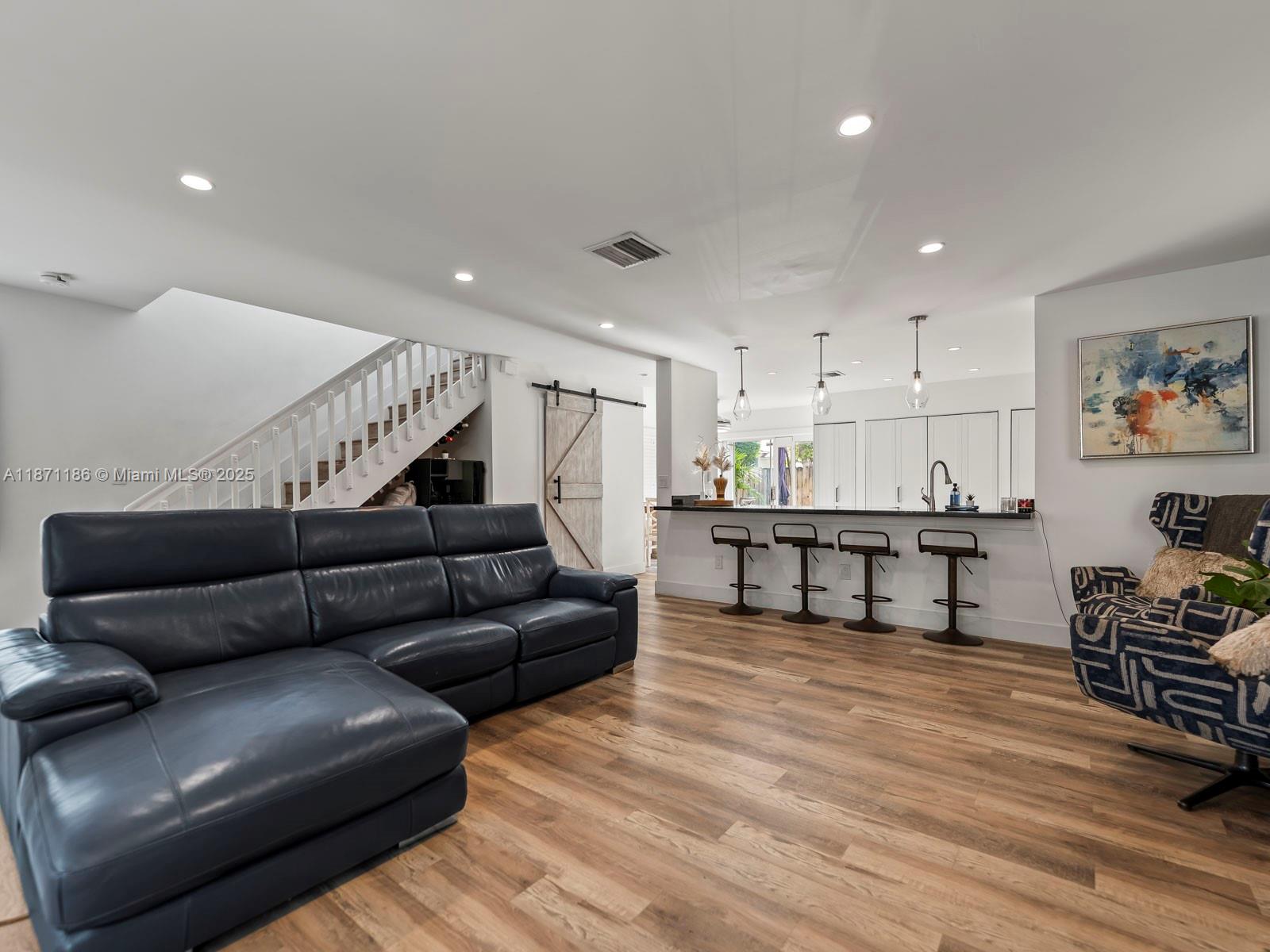 15293 Southwest 111th Street Miami, FL 33196 - Photo 18 of 32 a living room with furniture and wooden floor