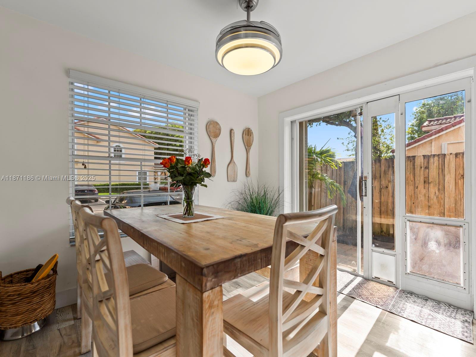 15293 Southwest 111th Street Miami, FL 33196 - Photo 20 of 32 a view of a dining room with furniture and chandelier
