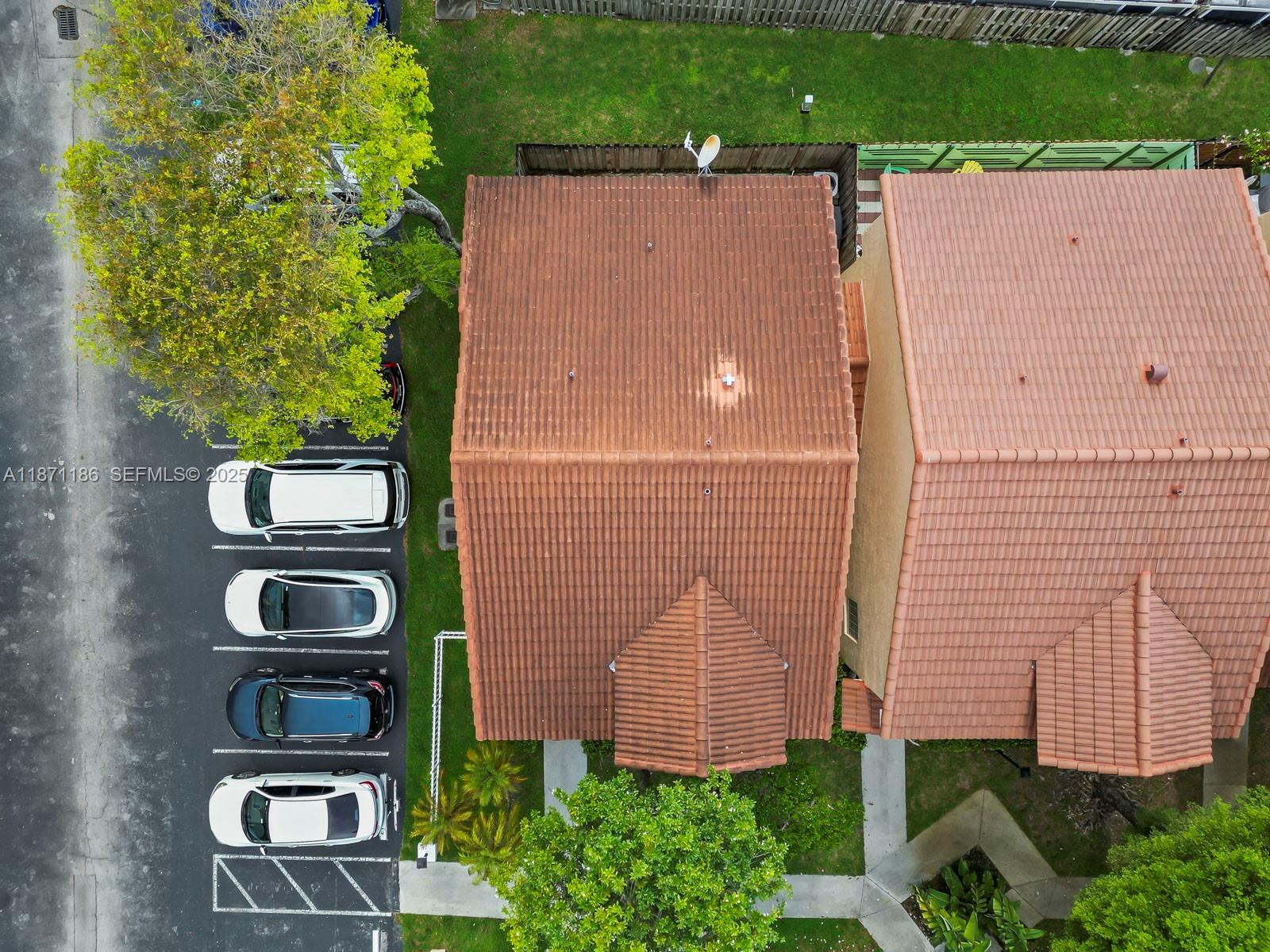 15293 Southwest 111th Street Miami, FL 33196 - Photo 2 of 32 an aerial view of a house with a yard