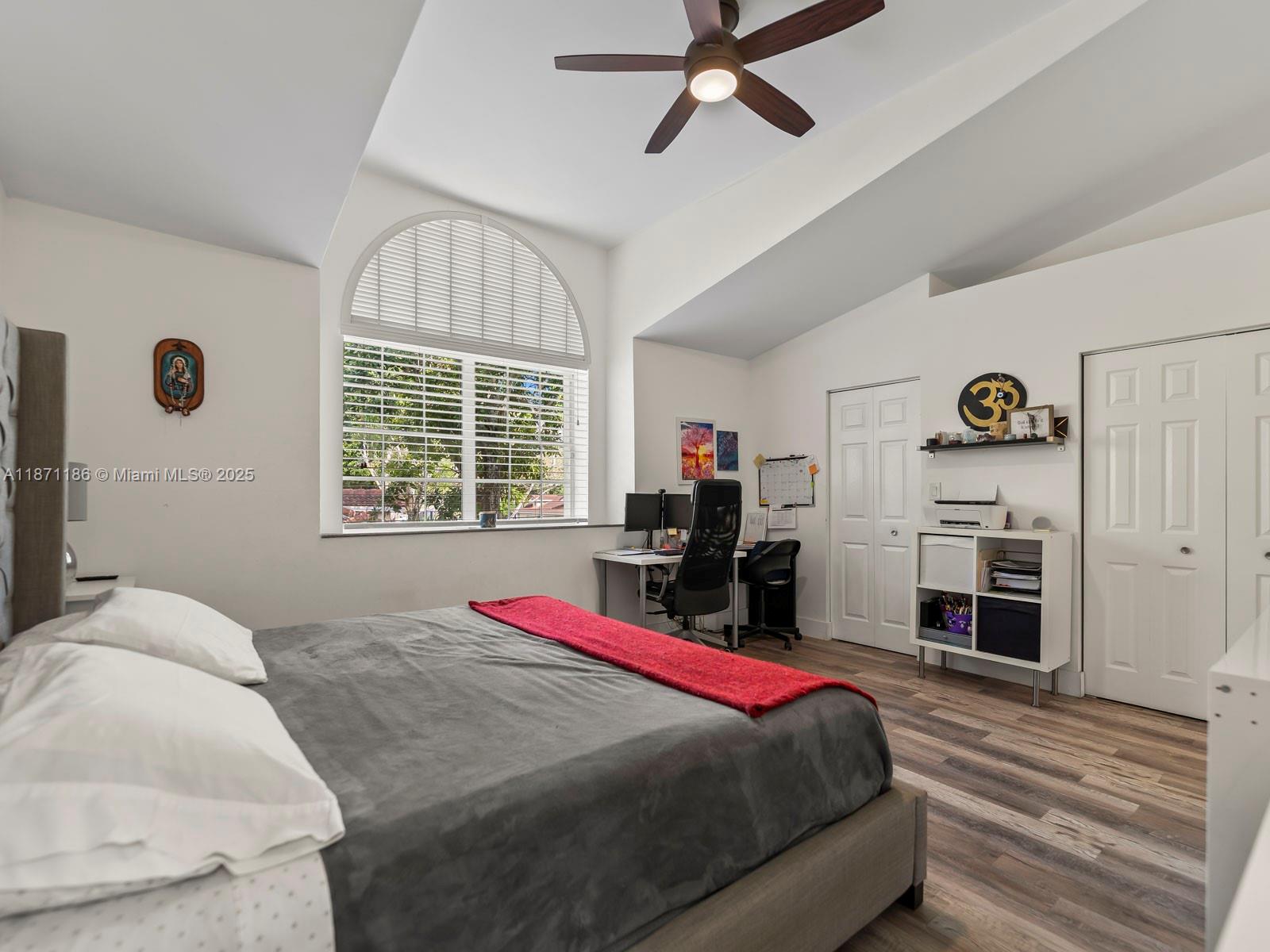 15293 Southwest 111th Street Miami, FL 33196 - Photo 23 of 32 a bed room with a bed and a television