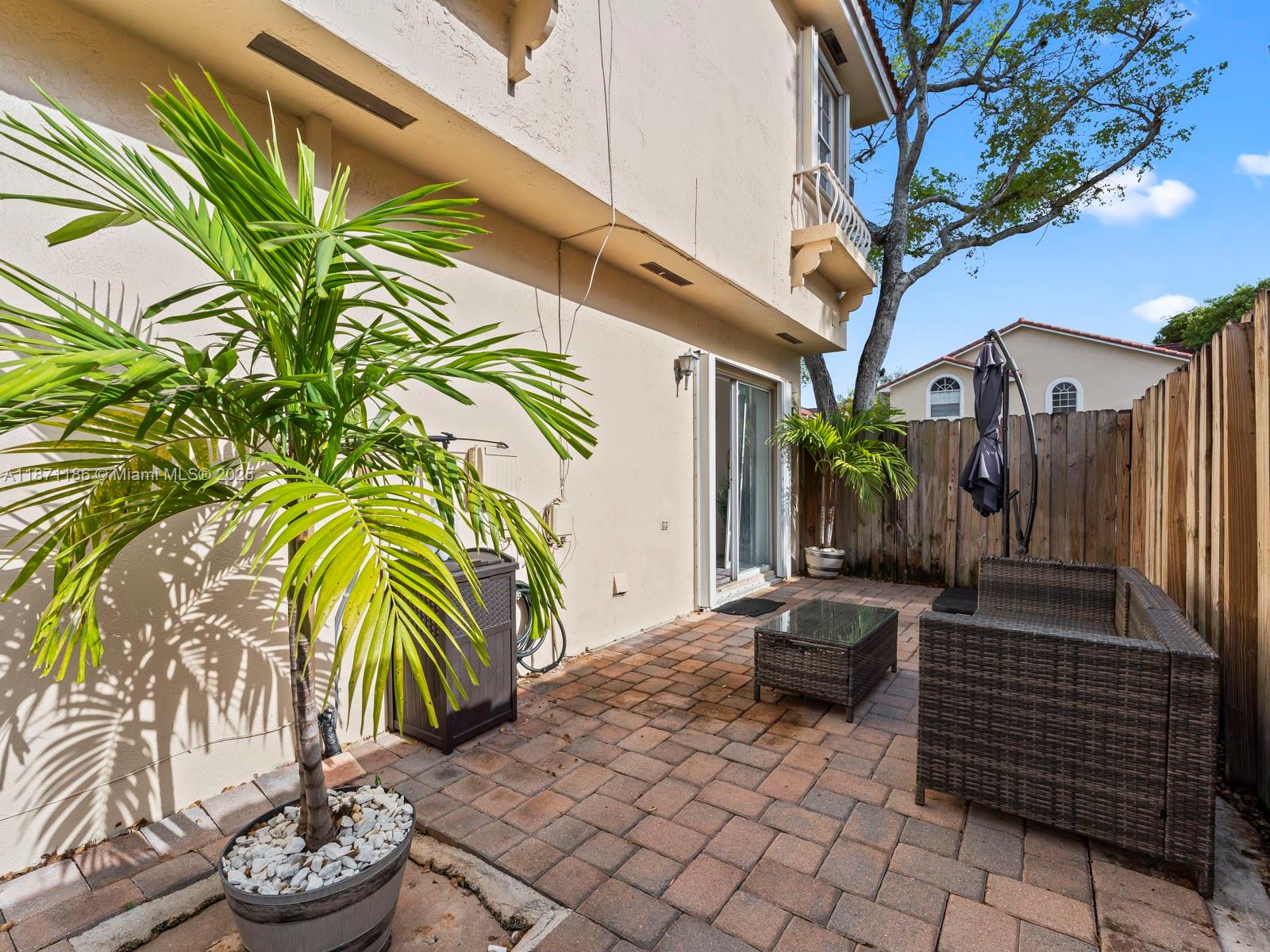 15293 Southwest 111th Street Miami, FL 33196 - Photo 31 of 32 a backyard of a house with barbeque oven table and chairs