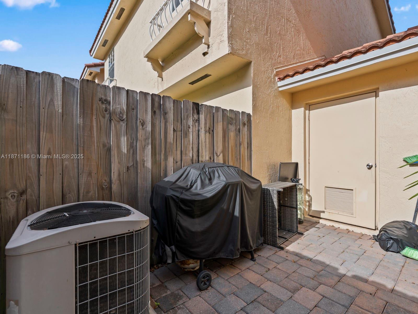 15293 Southwest 111th Street Miami, FL 33196 - Photo 32 of 32 a view of a balcony with furniture