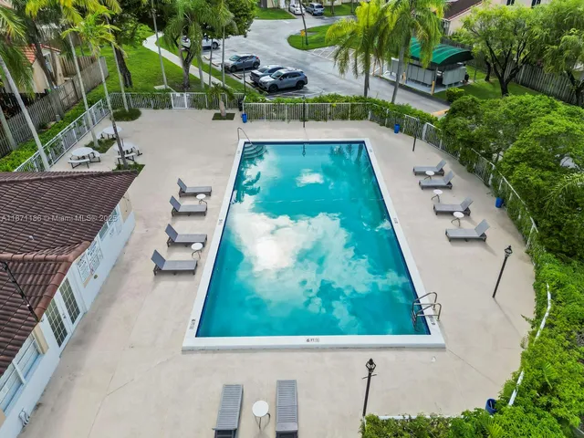 a view of swimming pool from a balcony