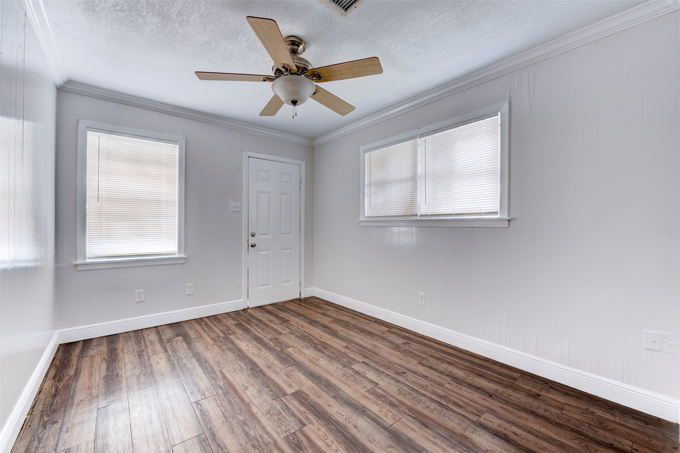 1209 Cabell Street Houston, TX 77022 - Photo 3 of 16 a view of room with window ceiling fan and hardwood floor