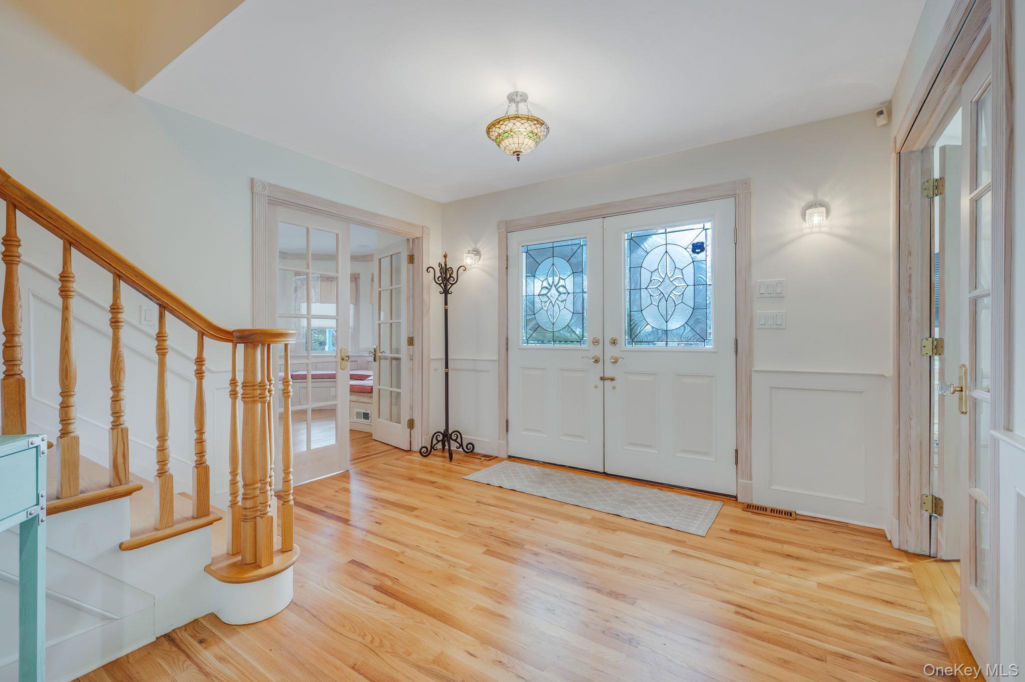 300 Private Road, Unit 8 Cutchogue, NY 11935 - Photo 17 of 47 a view of an entryway with wooden floor