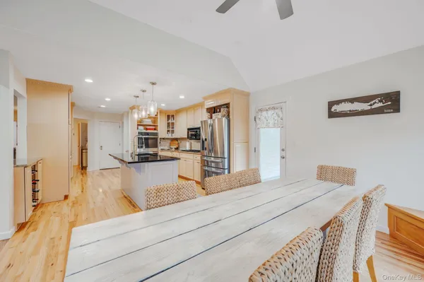 a view of kitchen with cabinets and wooden floor