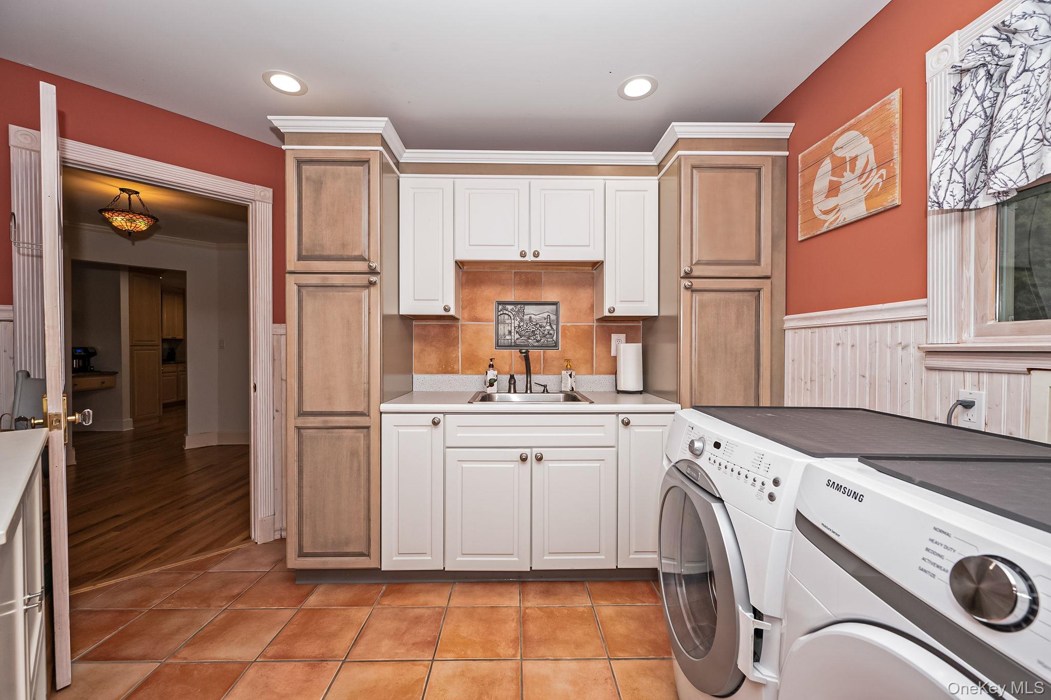 300 Private Road, Unit 8 Cutchogue, NY 11935 - Photo 29 of 47 a utility room with closet a washer and dryer