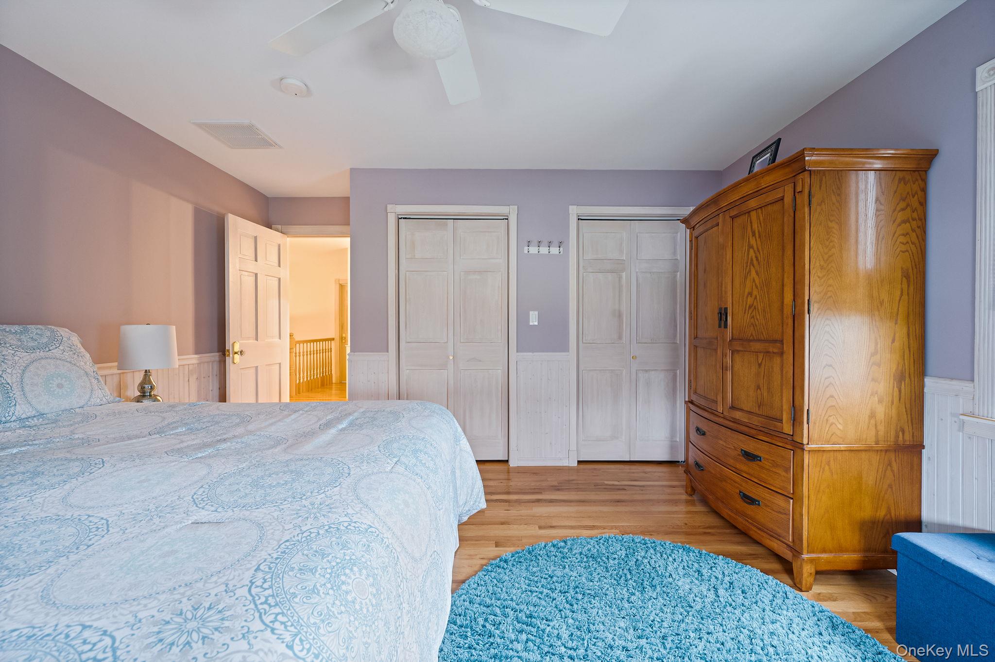 300 Private Road, Unit 8 Cutchogue, NY 11935 - Photo 33 of 47 a spacious bedroom with a bed and a dresser