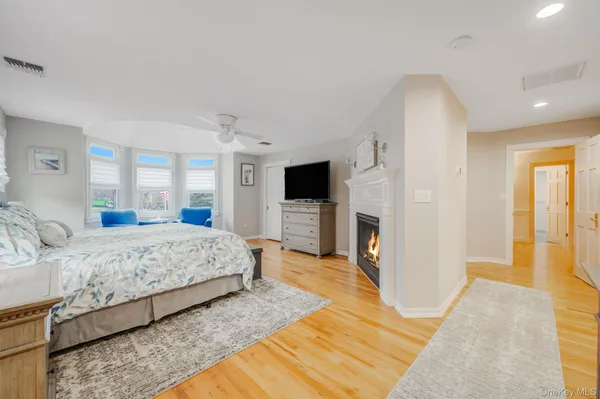 a bedroom with a large bed and a dresser