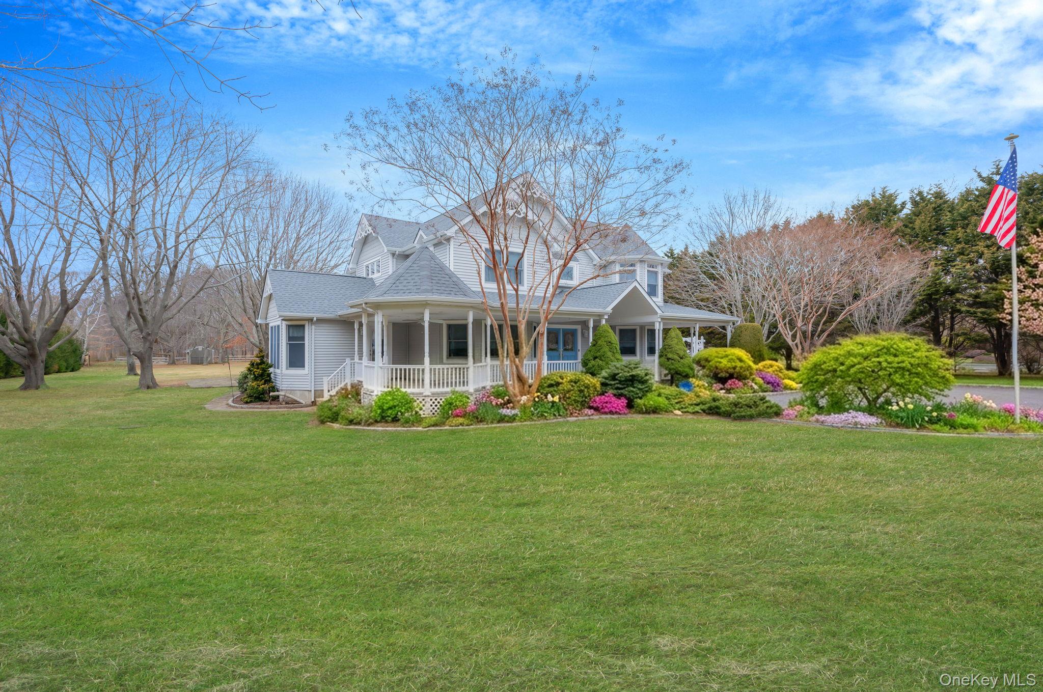 300 Private Road, Unit 8 Cutchogue, NY 11935 - Photo 4 of 47 a front view of a house with garden