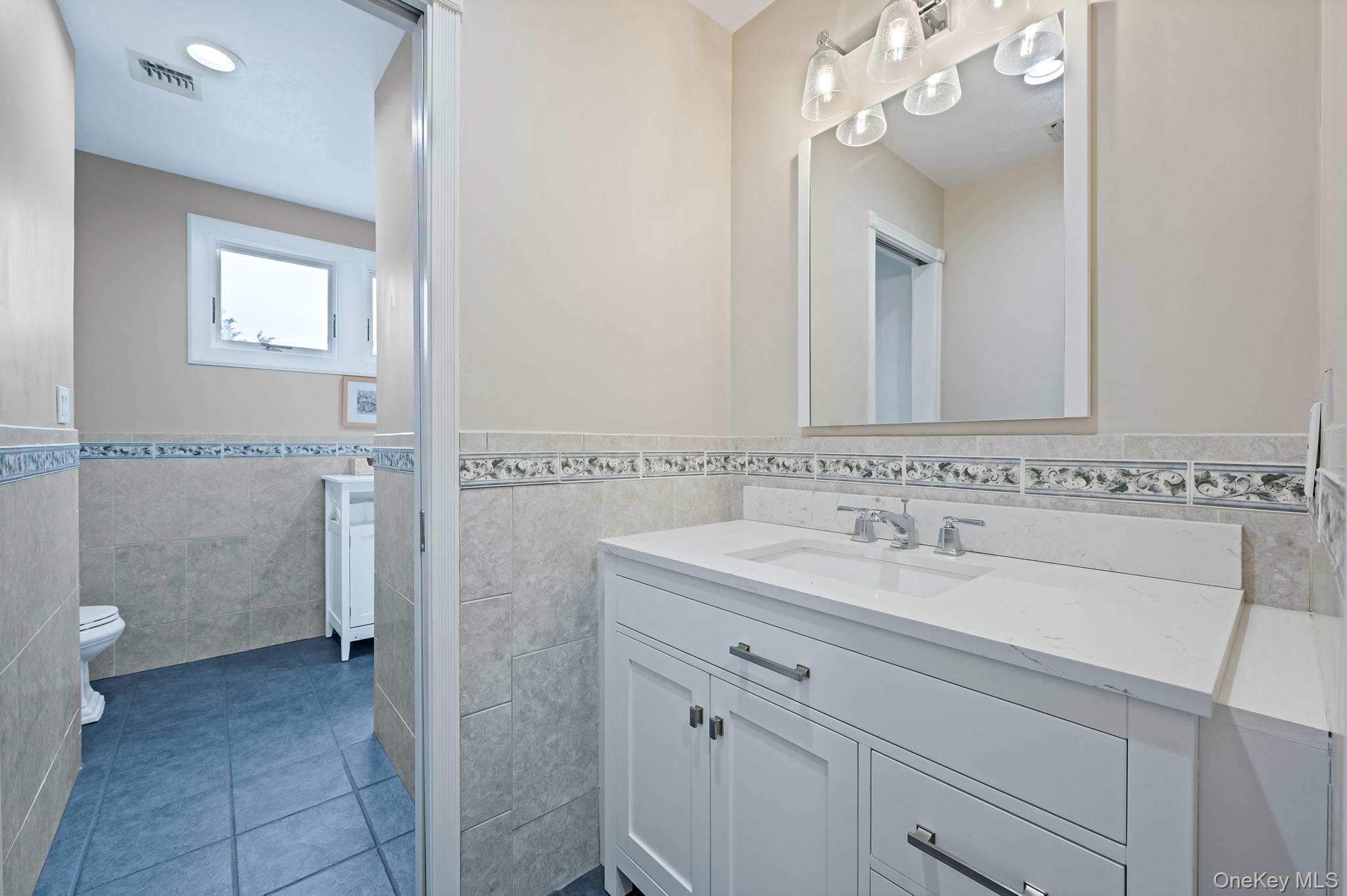 300 Private Road, Unit 8 Cutchogue, NY 11935 - Photo 43 of 47 a bathroom with a sink and a toilet