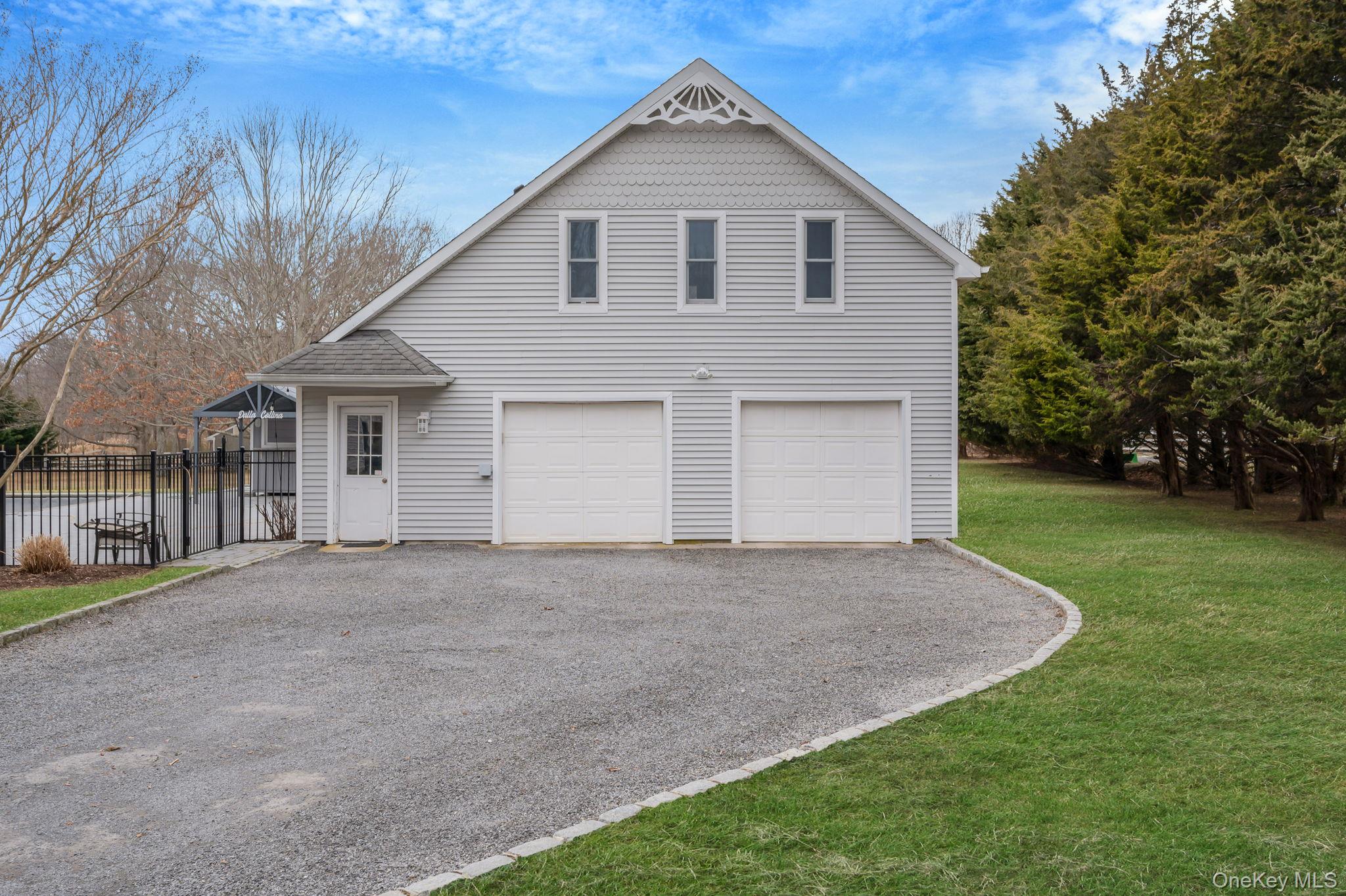 300 Private Road, Unit 8 Cutchogue, NY 11935 - Photo 8 of 47 a front view of house with yard and green space