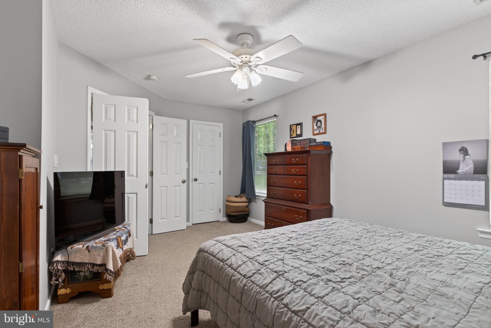 3917 Longhill Station Road Williamsburg, VA 23188 - Photo 18 of 29 Cozy bedroom with natural light.