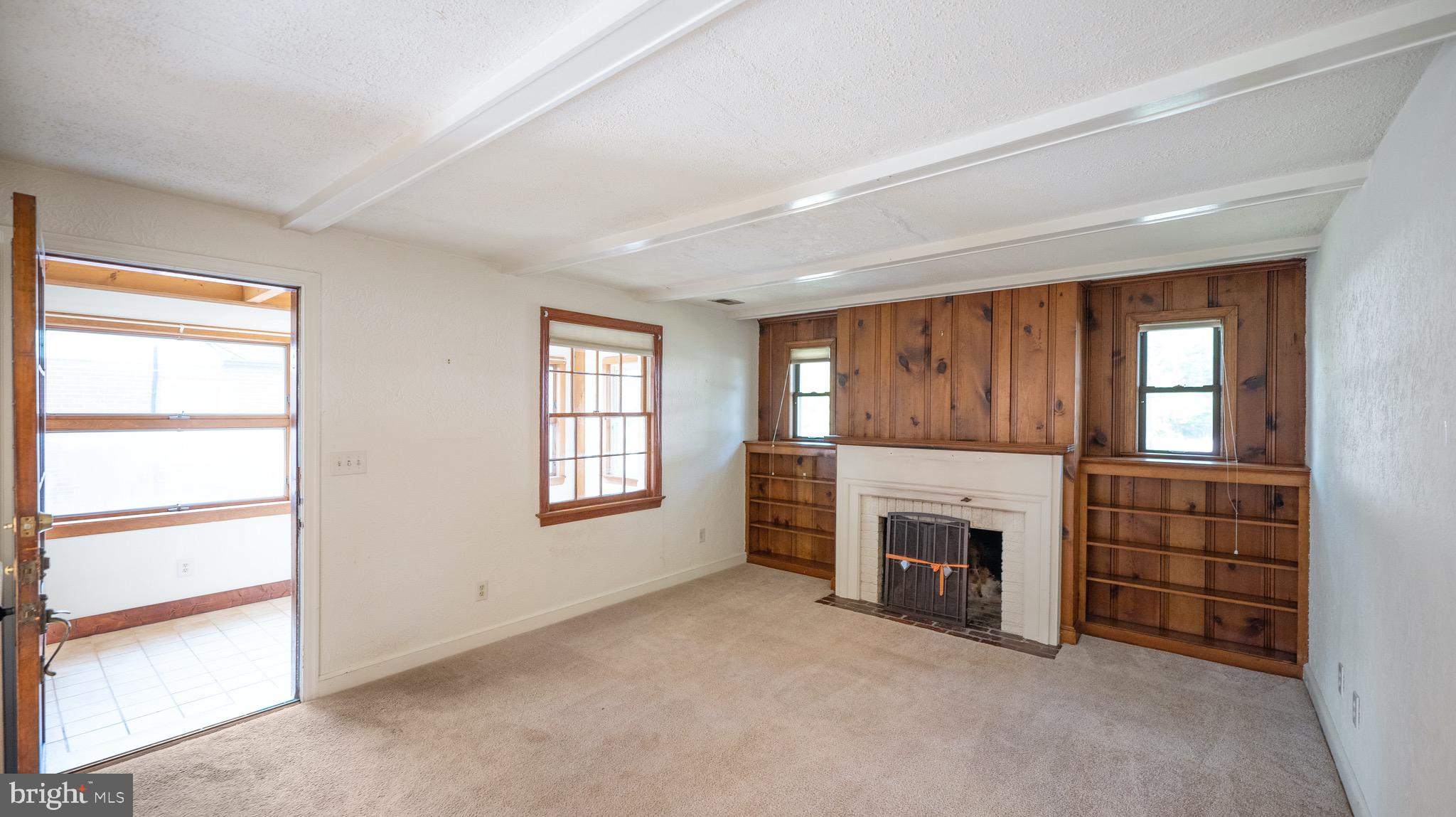 10015 Dallas Avenue Silver Spring, MD 20901 - Photo 5 of 30 Living room with built-ins & wood fireplace