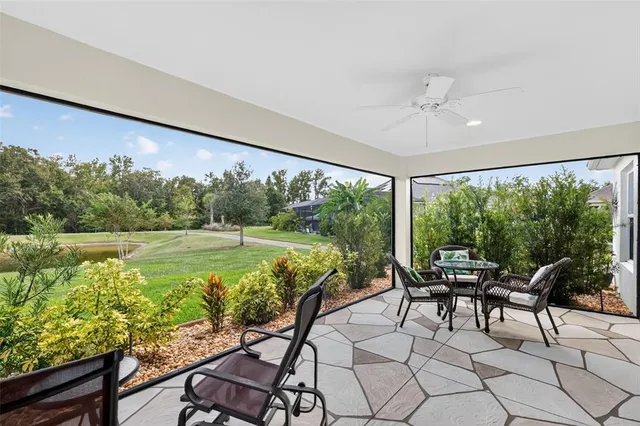 a view of a balcony with chairs and a table