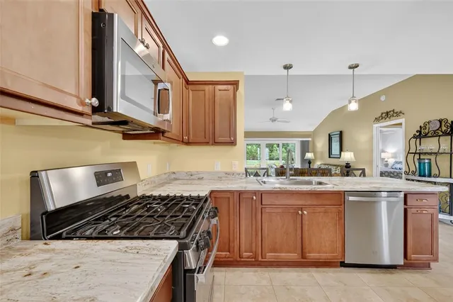 a kitchen with a stove and a sink