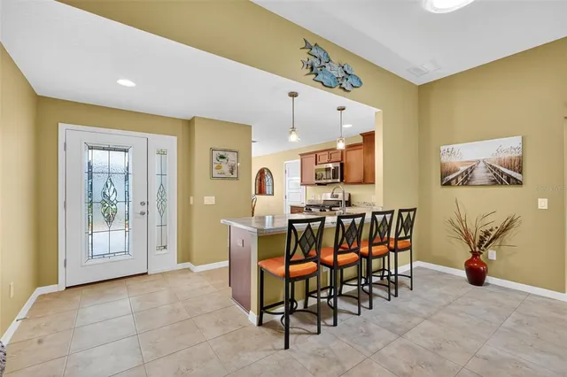 a view of a a dining room with furniture window and outside view