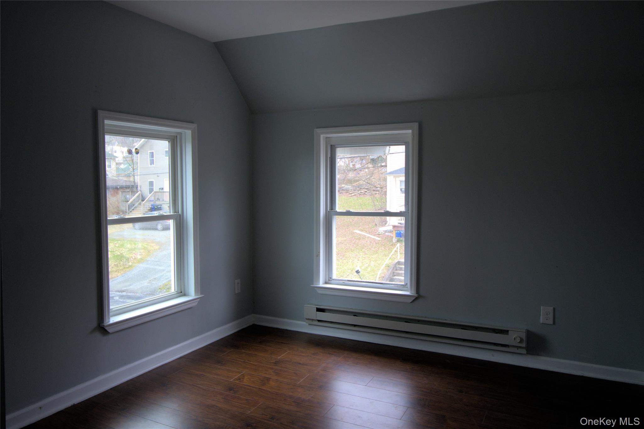 9 Spring Street Liberty, NY 12754 - Photo 20 of 29 Room with two windows, wood-finish flooring, and gray walls