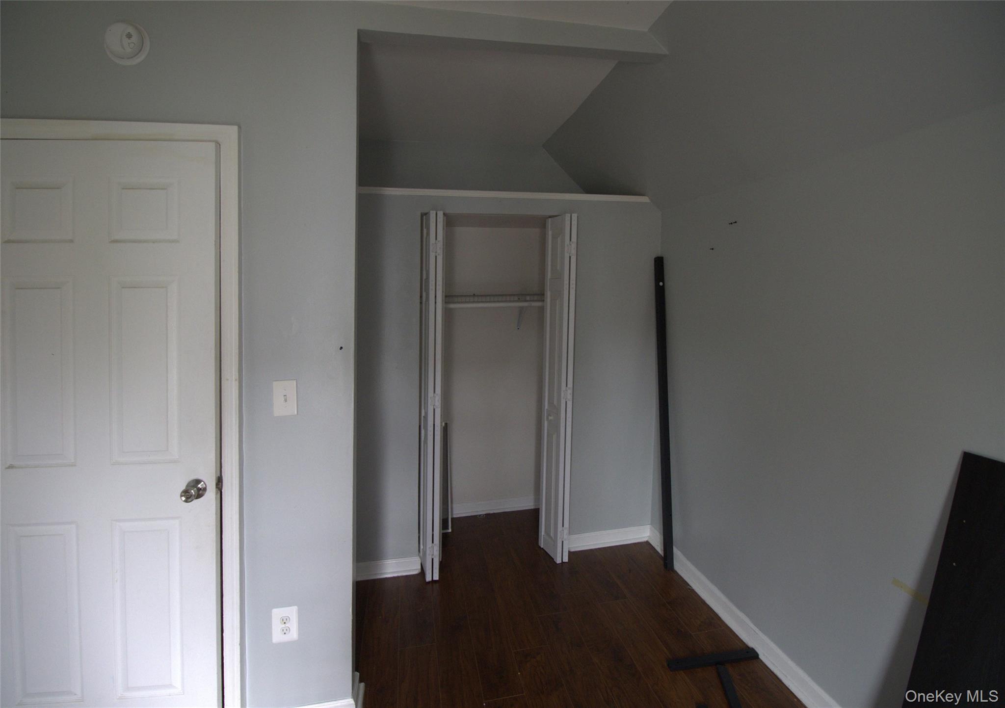 9 Spring Street Liberty, NY 12754 - Photo 24 of 29 Room featuring light gray painted walls and wood-finish flooring