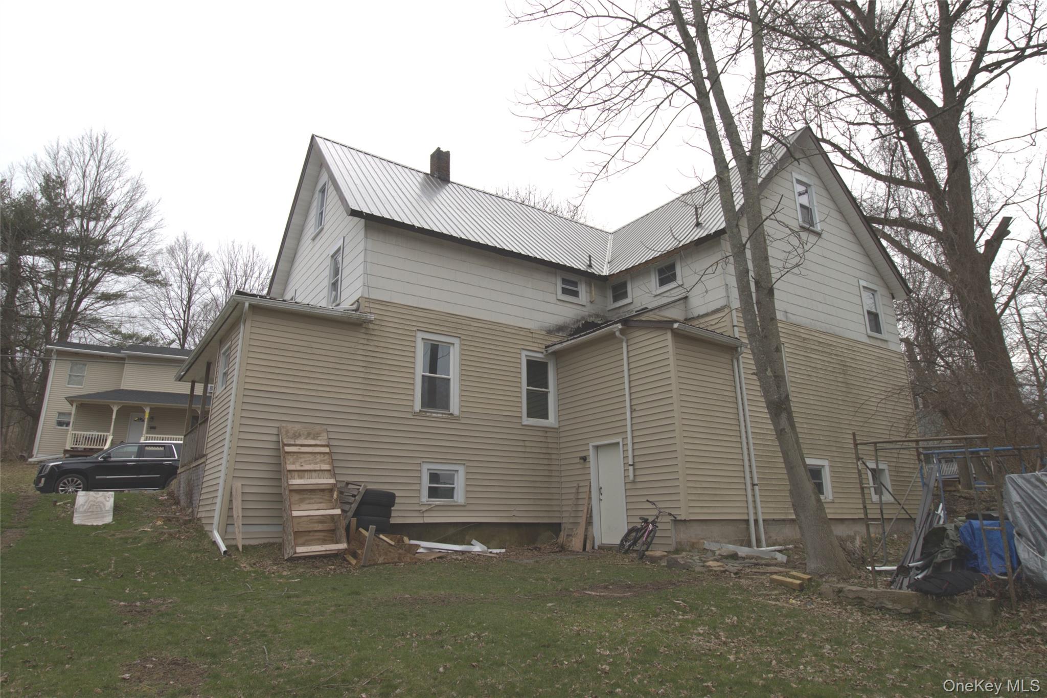 9 Spring Street Liberty, NY 12754 - Photo 29 of 29 Two-story property with a metal roof and light-colored siding