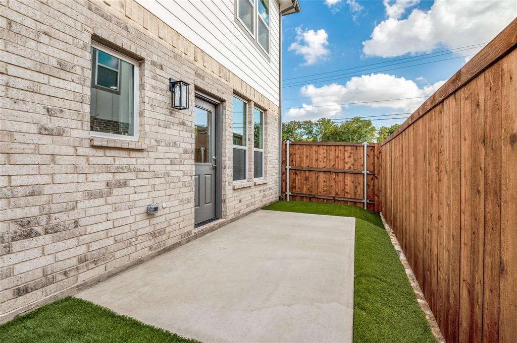7307 Rubio Place Dallas, TX 75235 - Photo 17 of 17 a backyard of a house with lots of green space