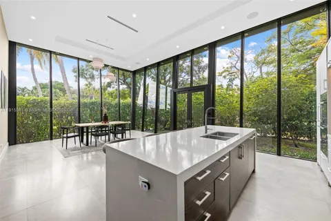 a living room with a large window and a table