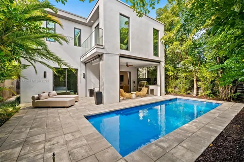 a view of outdoor kitchen and living room