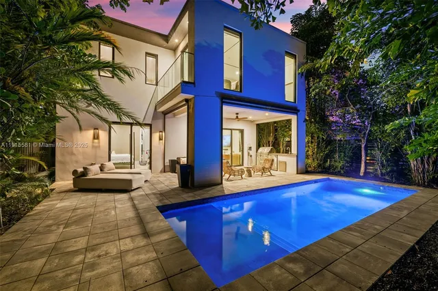 a view of a house with pool table and chairs
