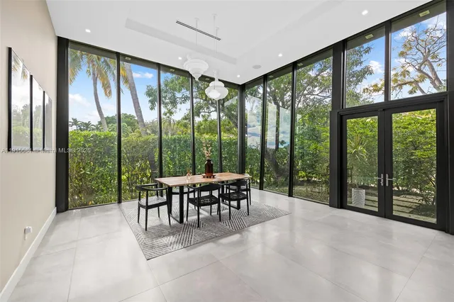a view of a big room with balcony and furniture