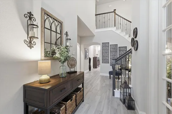 a living room with furniture and wooden floor