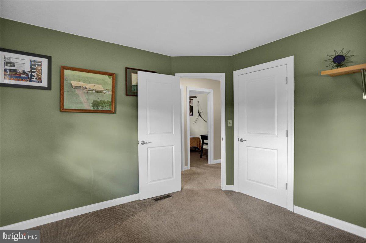 692 Brownsville Road Reading, PA 19608 - Photo 15 of 43 an empty room with closet and a bathroom