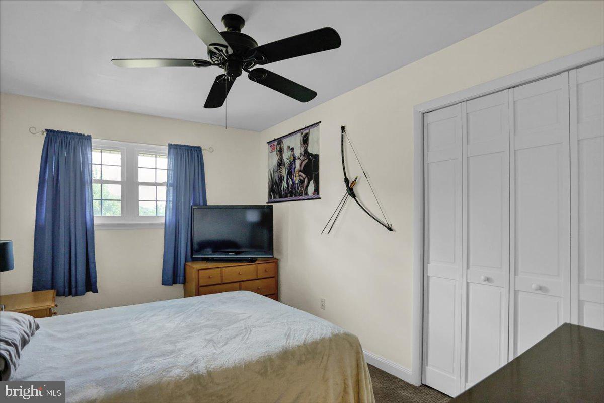 692 Brownsville Road Reading, PA 19608 - Photo 18 of 43 a bedroom with a bed and a chandelier